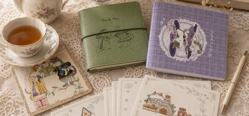 Quiet TEAPURR desk with Afternoon Tea sage journal, Petit à Petit notebook, and letter paper